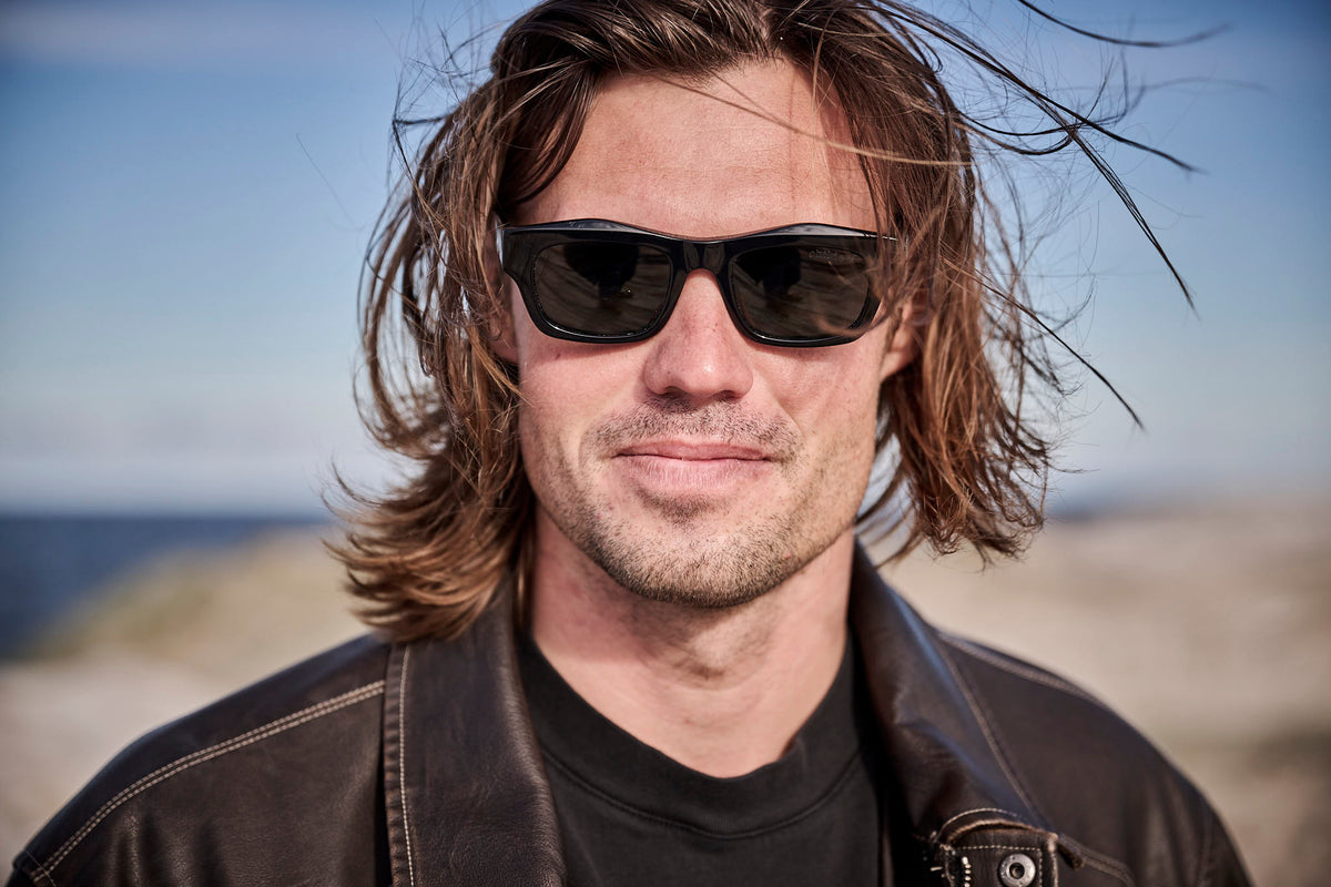 Kipp Caddy wearing black Childe sunglasses