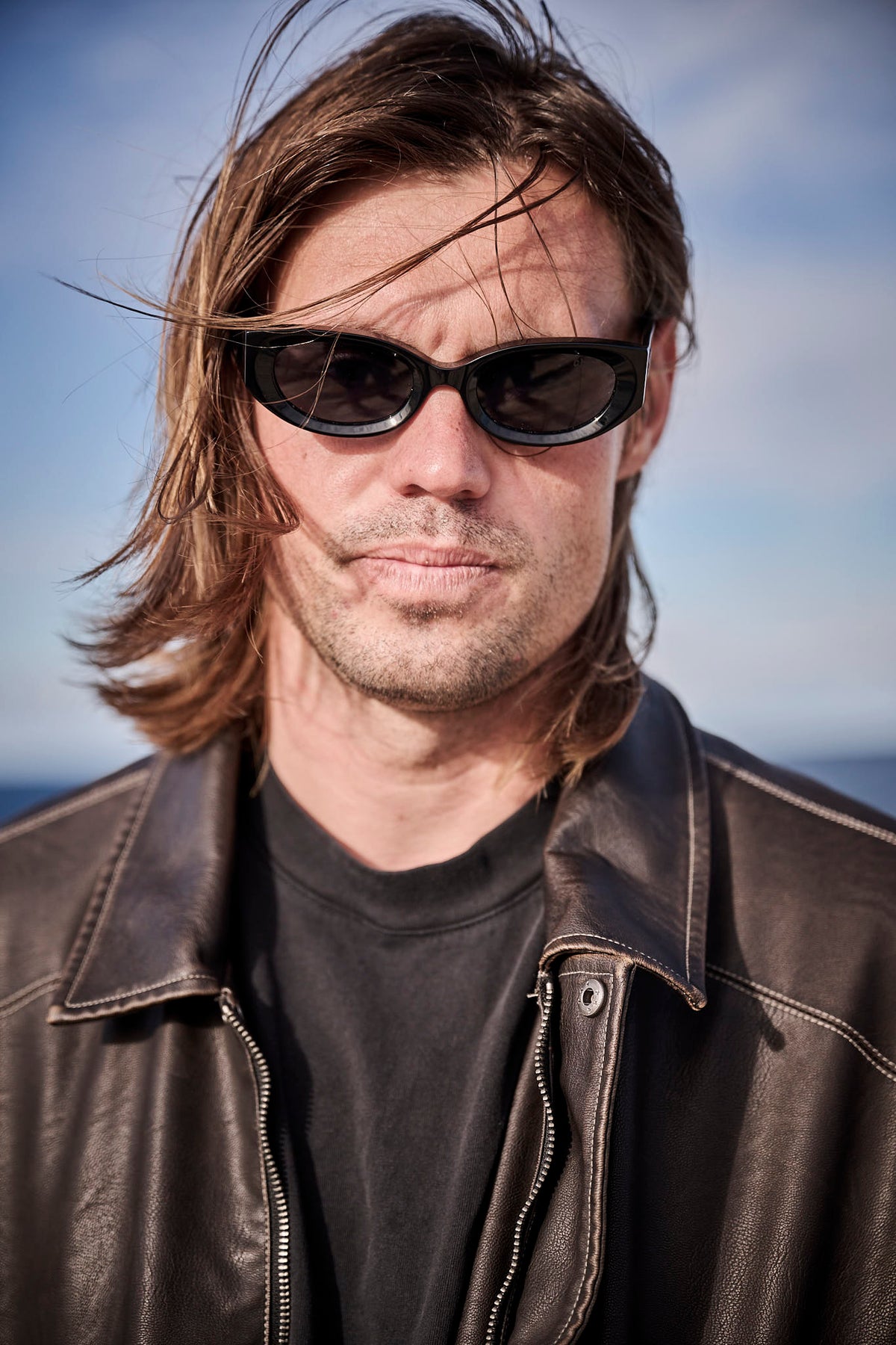 Kipp Caddy wearing black Childe sunglasses