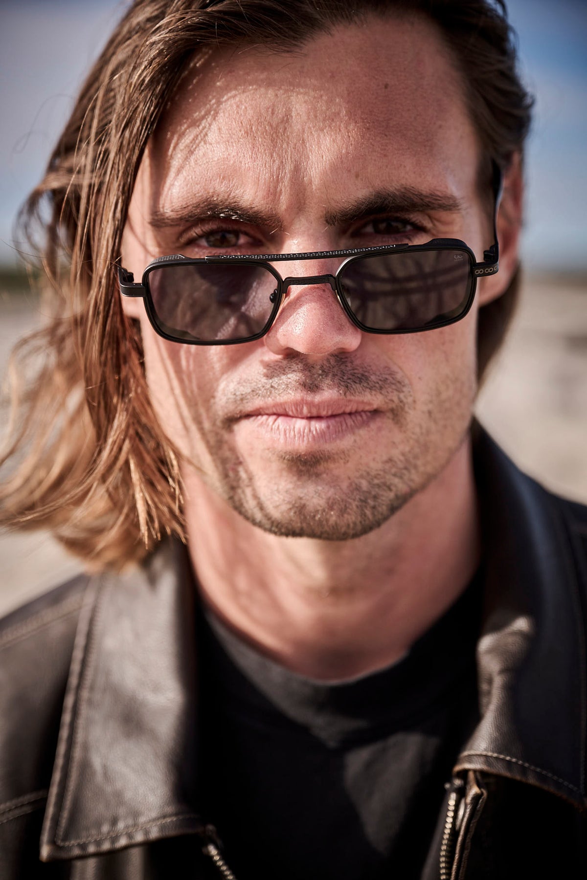 Kipp Caddy wearing Childe Eyewear on the coast